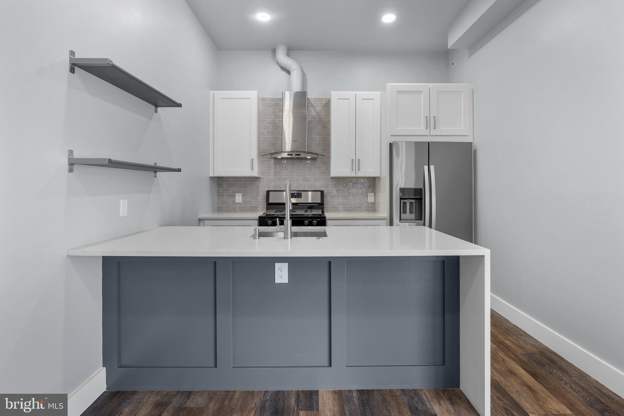 342 West Queen Lane, Unit 5 Philadelphia, PA 19144 - Photo 9 of 18 a kitchen with stainless steel appliances a sink stove and cabinets