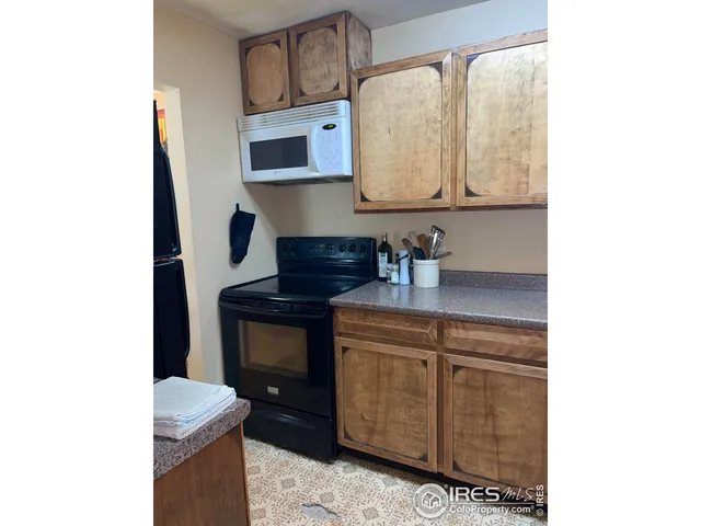a kitchen with stainless steel appliances granite countertop a sink and a cabinets