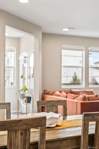 a kitchen with stainless steel appliances granite countertop a stove a sink a microwave a refrigerator and white cabinets