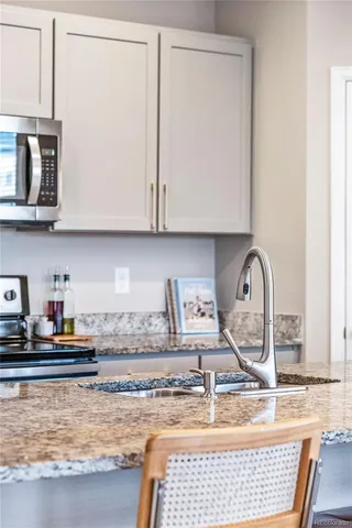 a bathroom with a sink mirror and toilet