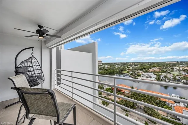 a view of a balcony with furniture