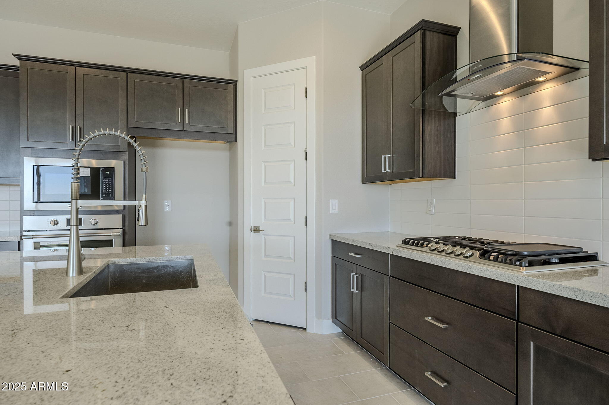 18949 West Ocotillo Road Waddell, AZ 85355 - Photo 6 of 31 Cooktop and Range Hood