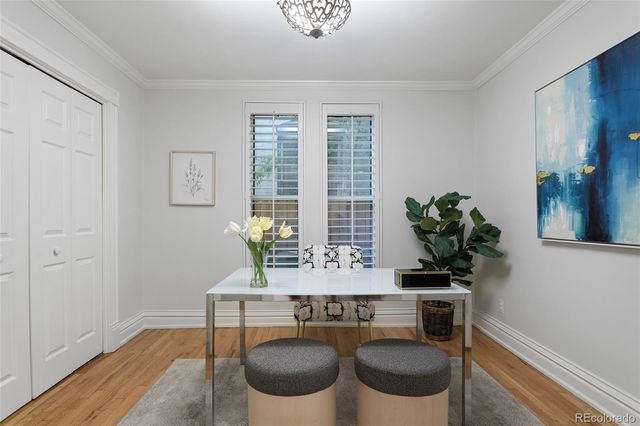 a view of a dining room with furniture and wooden floor