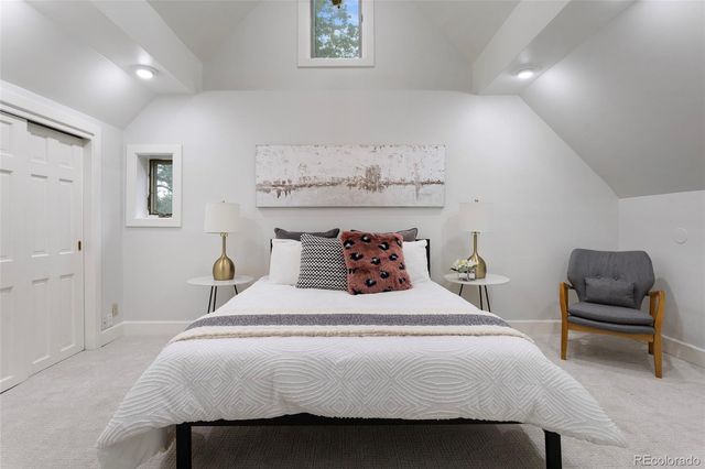 a bedroom with a bed and a walk in closet