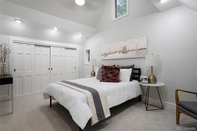 a bedroom with bed and wooden floor