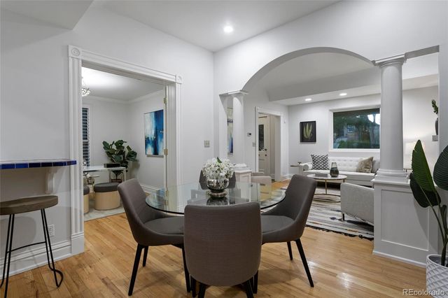 a view of a dining room with furniture and window