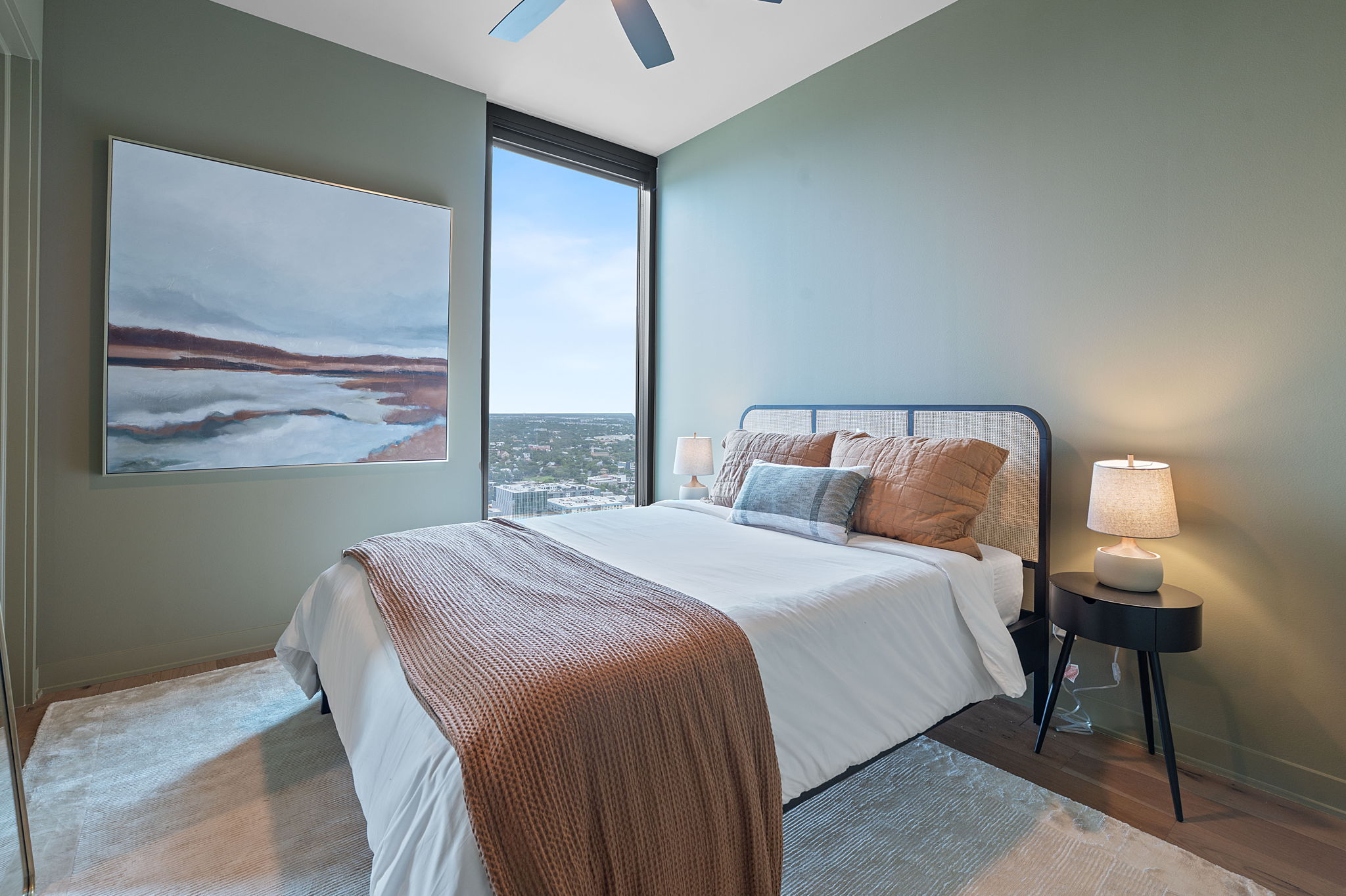 84 East Avenue, Unit 2403 Austin, TX 78701 - Photo 2 of 29 a bedroom with a bed and a window