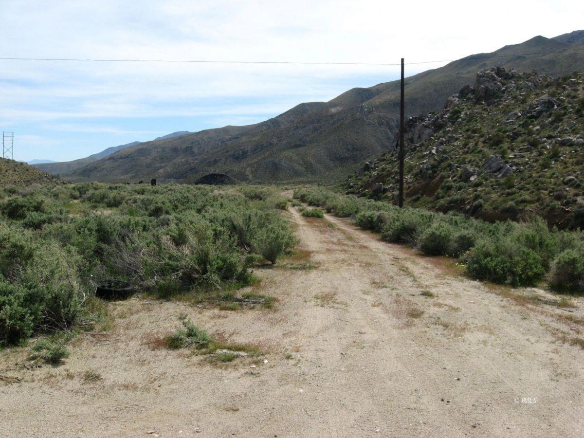 350 Little Lake Road Inyokern, CA 93527 - Photo 11 of 26 a view of a dry yard with mountains in the background