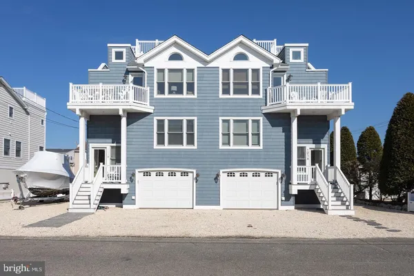 a front view of a residential apartment building with a front door