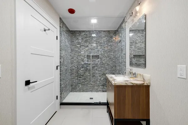a bathroom with a sink and a mirror