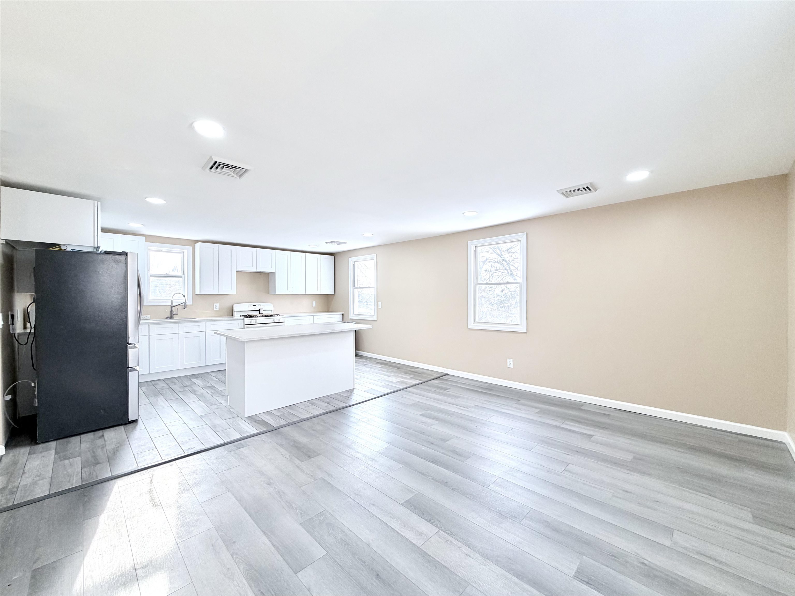 1572 Summit Avenue, Unit 2 Hillside, NJ 07205 - Photo 7 of 20 a kitchen with a refrigerator and a sink