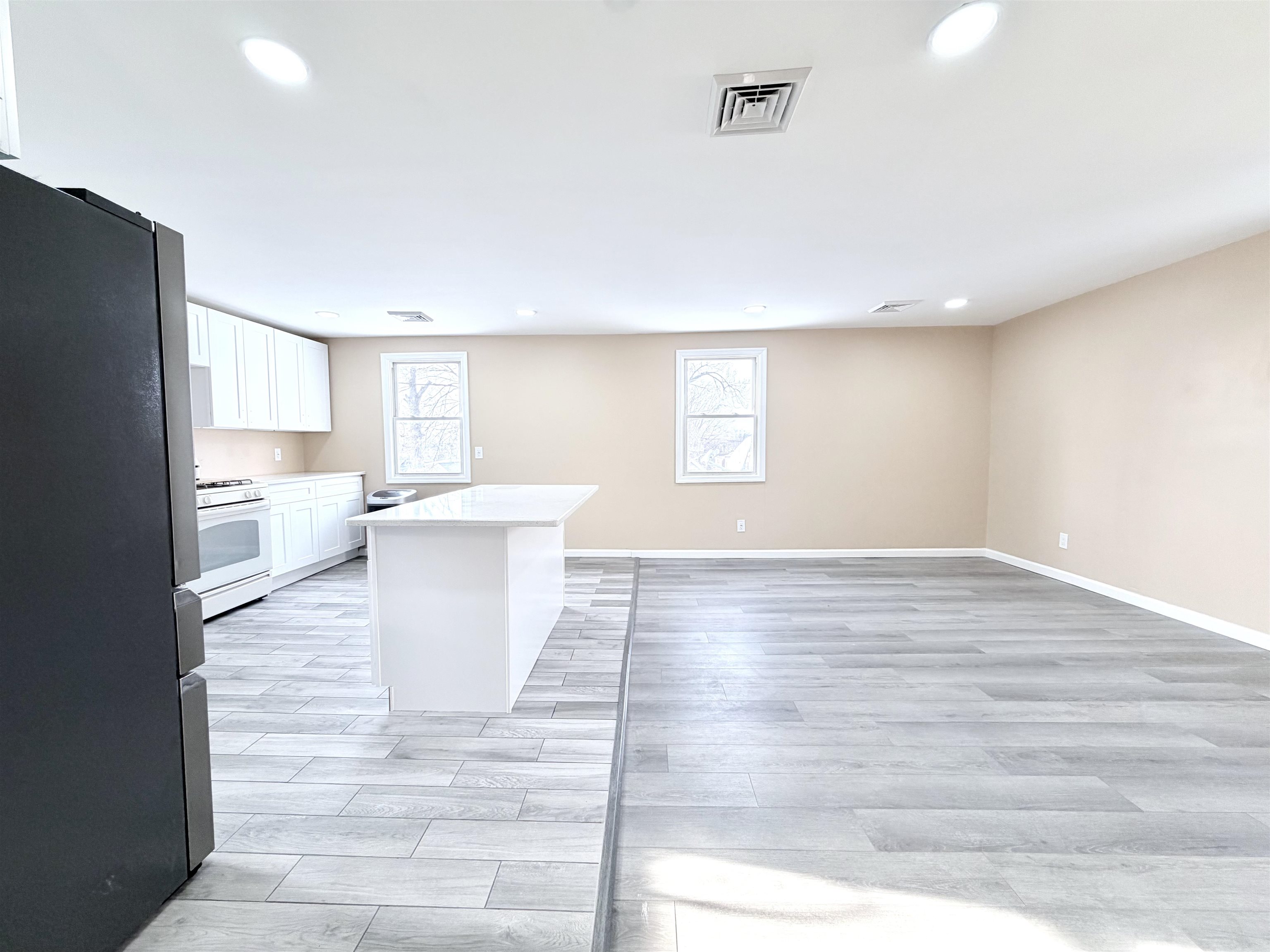1572 Summit Avenue, Unit 2 Hillside, NJ 07205 - Photo 8 of 20 a view of a kitchen and windows