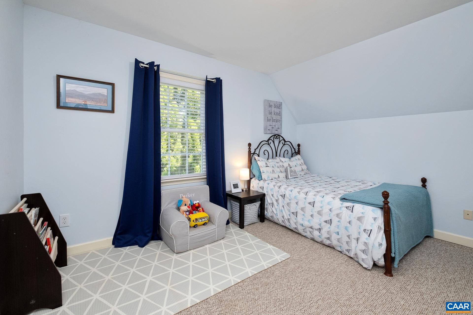 1285 Amber Ridge Road Crozet, VA 22901 - Photo 26 of 33 a bedroom with bed and a window