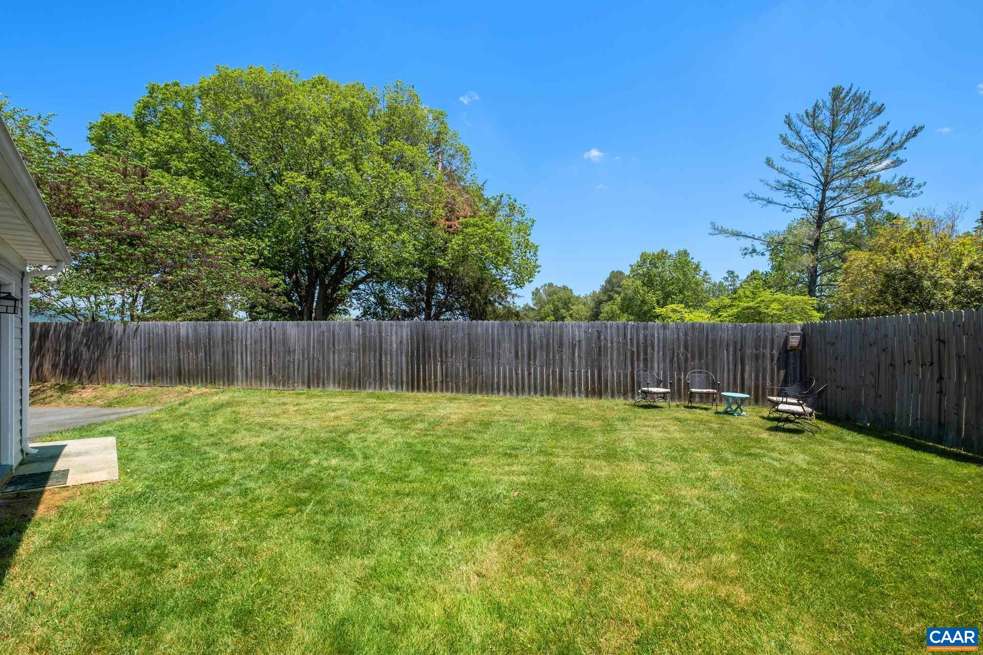 1285 Amber Ridge Road Crozet, VA 22901 - Photo 33 of 33 a view of a backyard with a fence and plants
