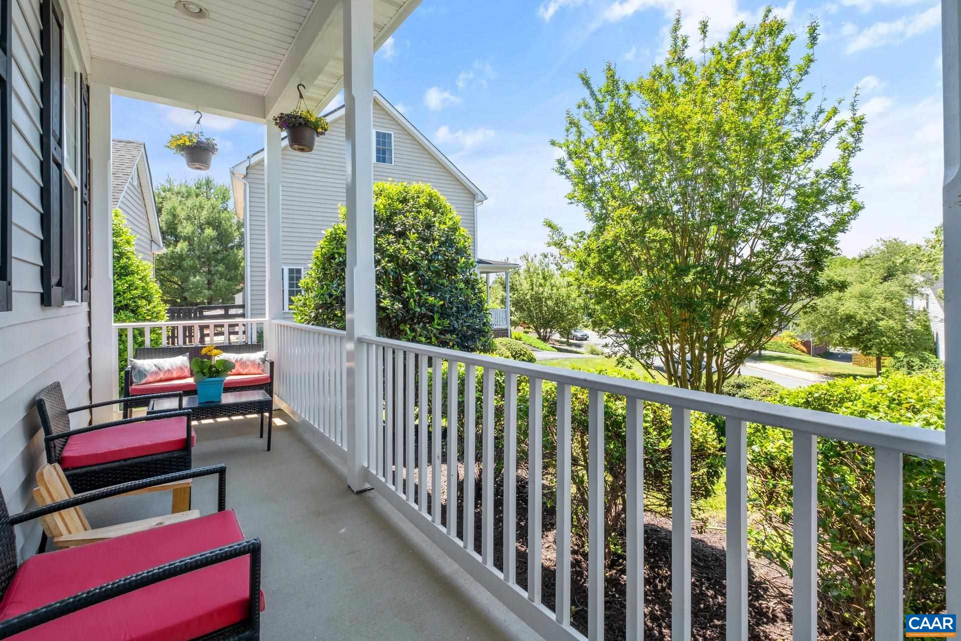 1285 Amber Ridge Road Crozet, VA 22901 - Photo 4 of 33 a balcony with chairs and a potted plant