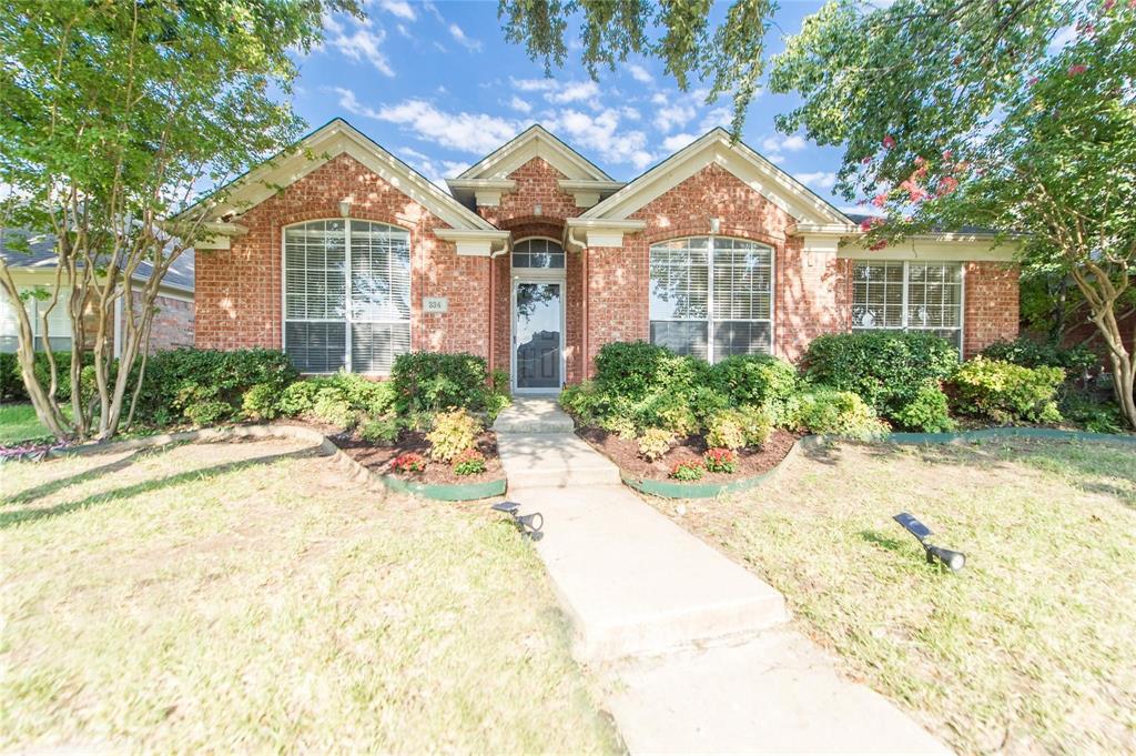334 Touchdown Drive Irving, TX 75063 - Photo 1 of 1 a front view of a house with a garden