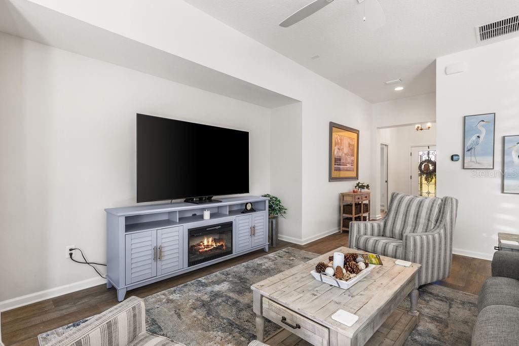 2938 Chimborazo Way The Villages, FL 32163 - Photo 20 of 50 a living room with furniture and a flat screen tv