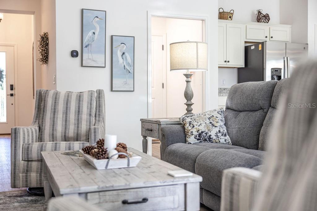 2938 Chimborazo Way The Villages, FL 32163 - Photo 25 of 50 a living room with furniture and a table