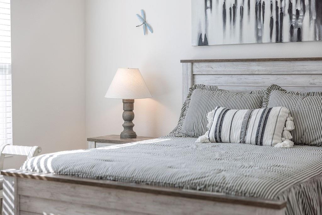 2938 Chimborazo Way The Villages, FL 32163 - Photo 41 of 50 a large bed sitting in a bedroom next to a window