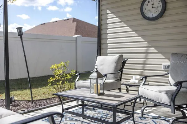 a view of a room with furniture and window