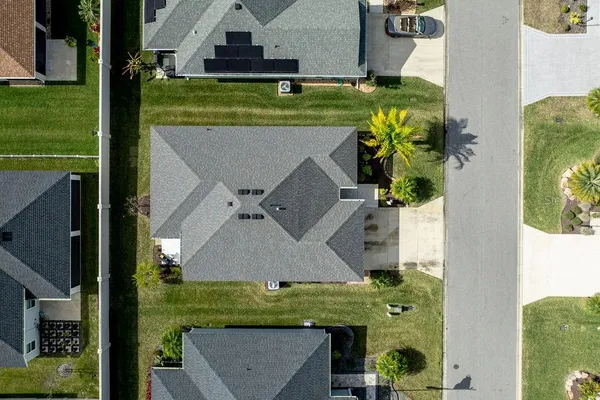 an aerial view of a house with a garden