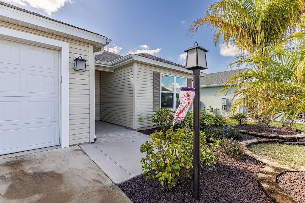 2938 Chimborazo Way The Villages, FL 32163 - Photo 10 of 50 a front view of a house with a yard