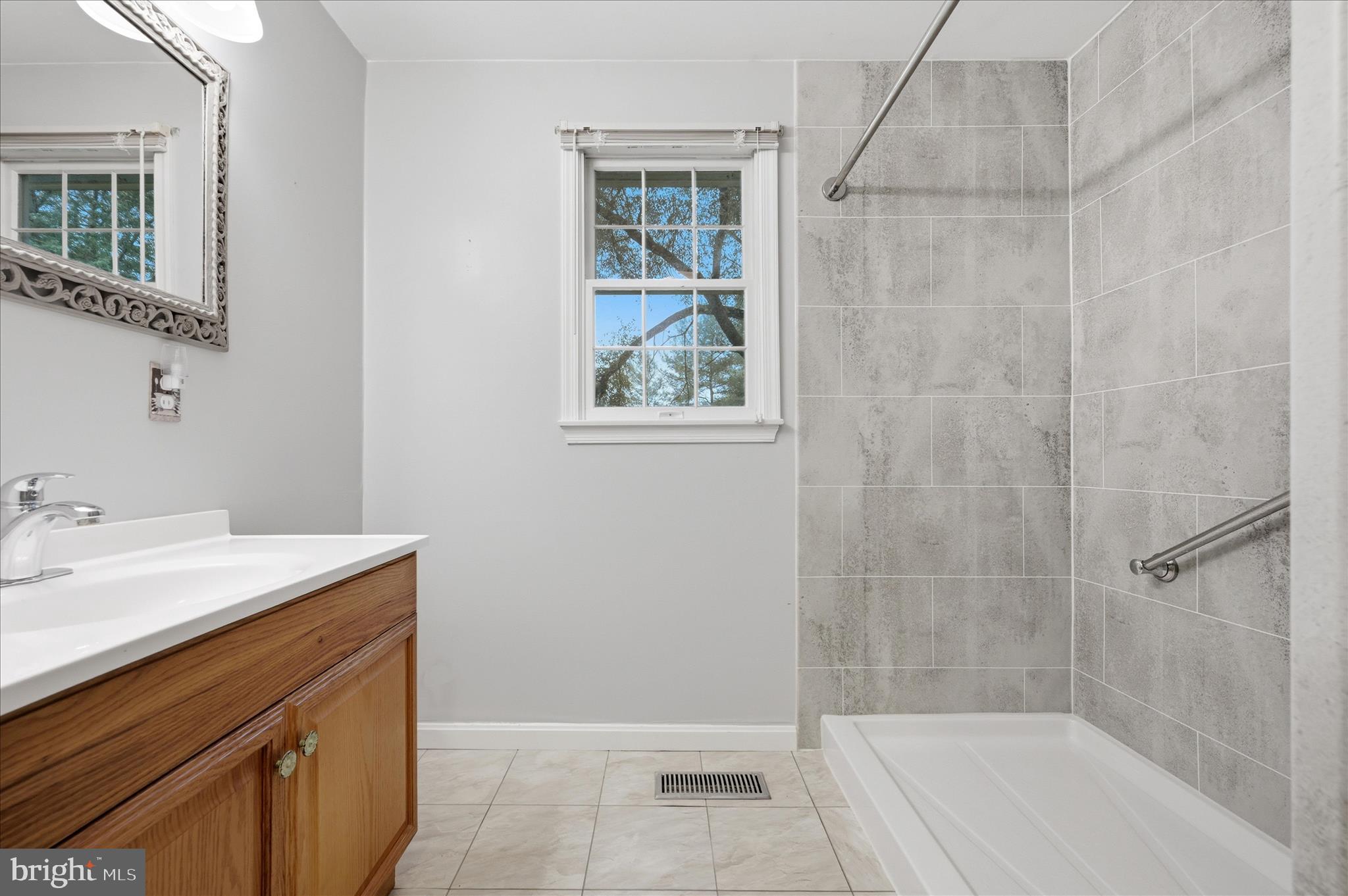 244 High Banks Road Stephenson, VA 22656 - Photo 27 of 45 a bathroom with a sink a vanity and a bathtub