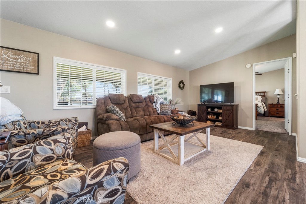 48197 Valley Center Road Newberry Springs, CA 92365 - Photo 13 of 30 a living room with furniture a flat screen tv and a large window