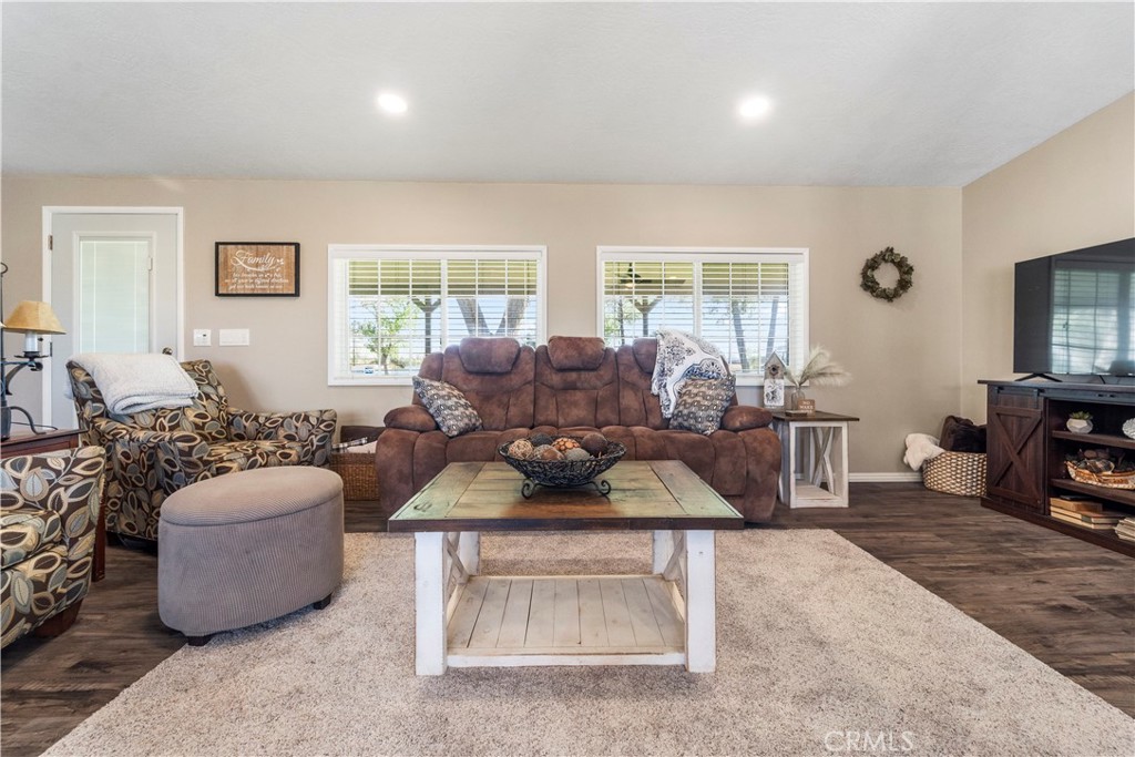 48197 Valley Center Road Newberry Springs, CA 92365 - Photo 14 of 30 a living room with furniture a large window and a fireplace