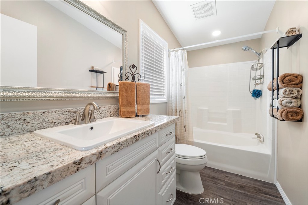 48197 Valley Center Road Newberry Springs, CA 92365 - Photo 21 of 30 a bathroom with a granite countertop sink toilet and shower