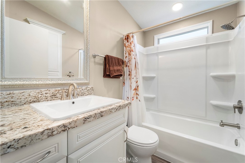 48197 Valley Center Road Newberry Springs, CA 92365 - Photo 22 of 30 a bathroom with a sink double vanity granite toilet tub and shower