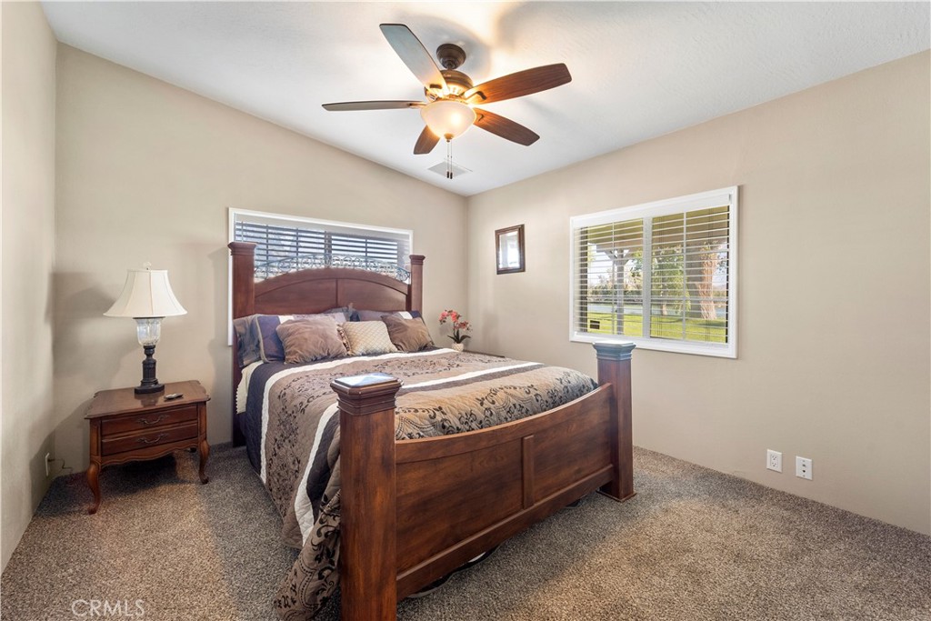 48197 Valley Center Road Newberry Springs, CA 92365 - Photo 25 of 30 a bedroom with a bed and a ceiling fan