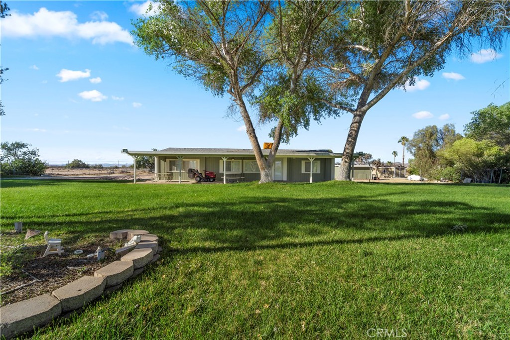 48197 Valley Center Road Newberry Springs, CA 92365 - Photo 29 of 30 a front view of a house with garden