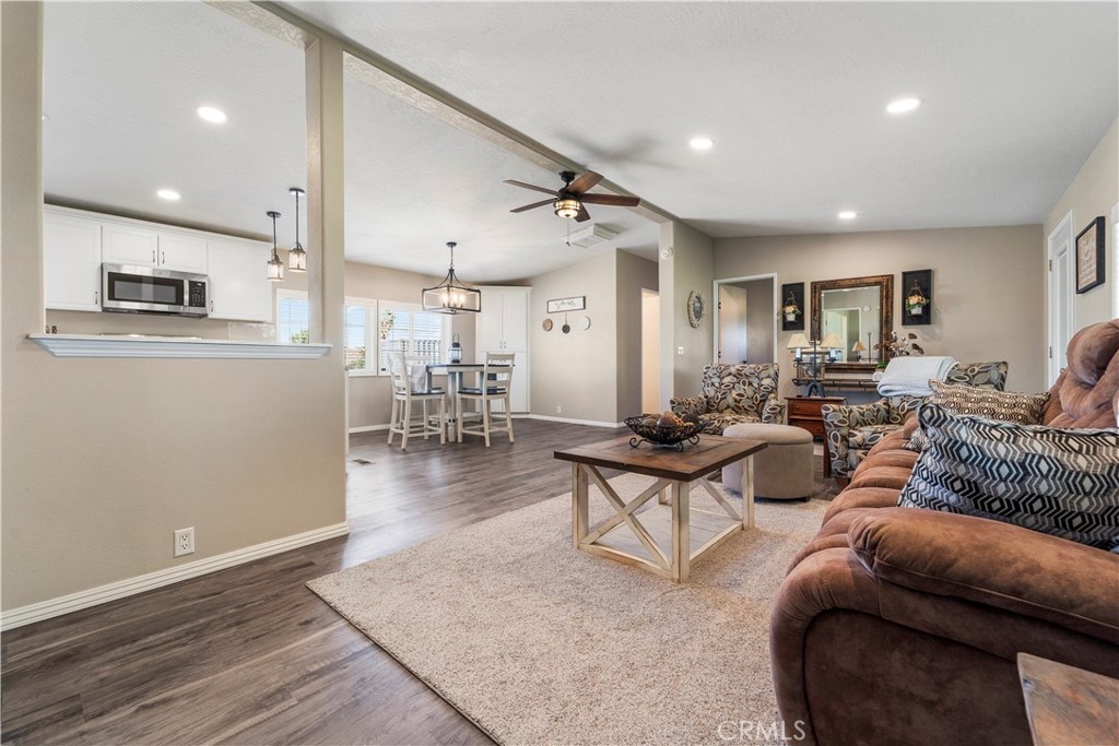 48197 Valley Center Road Newberry Springs, CA 92365 - Photo 4 of 30 a living room with furniture and a wooden floor