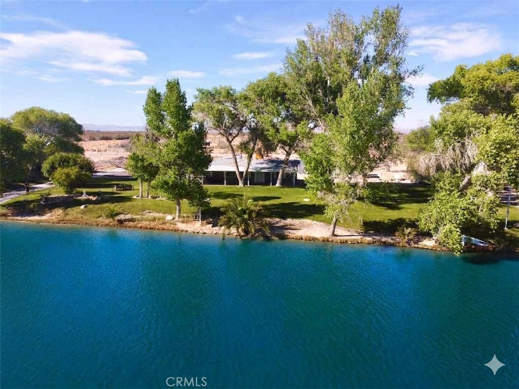 48197 Valley Center Road Newberry Springs, CA 92365 - Photo 5 of 30 a view of a houses with yard and lake