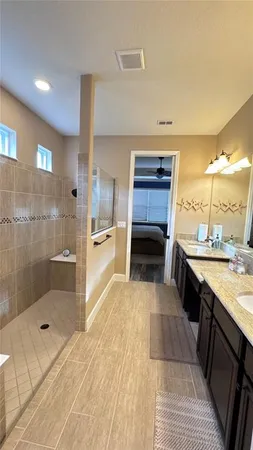 a living room with a sink and a mirror