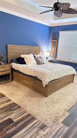 a bed room with a bed and a window