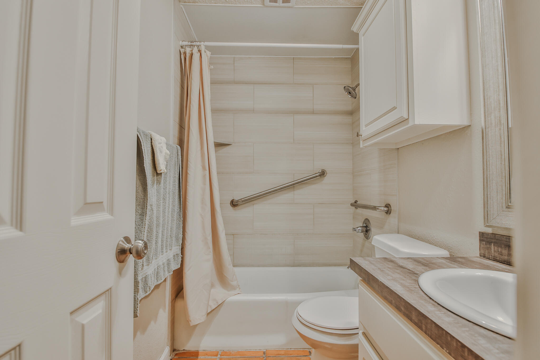 5437 45th Street Lubbock, TX 79414 - Photo 38 of 52 a bathroom with a granite countertop sink toilet and shower