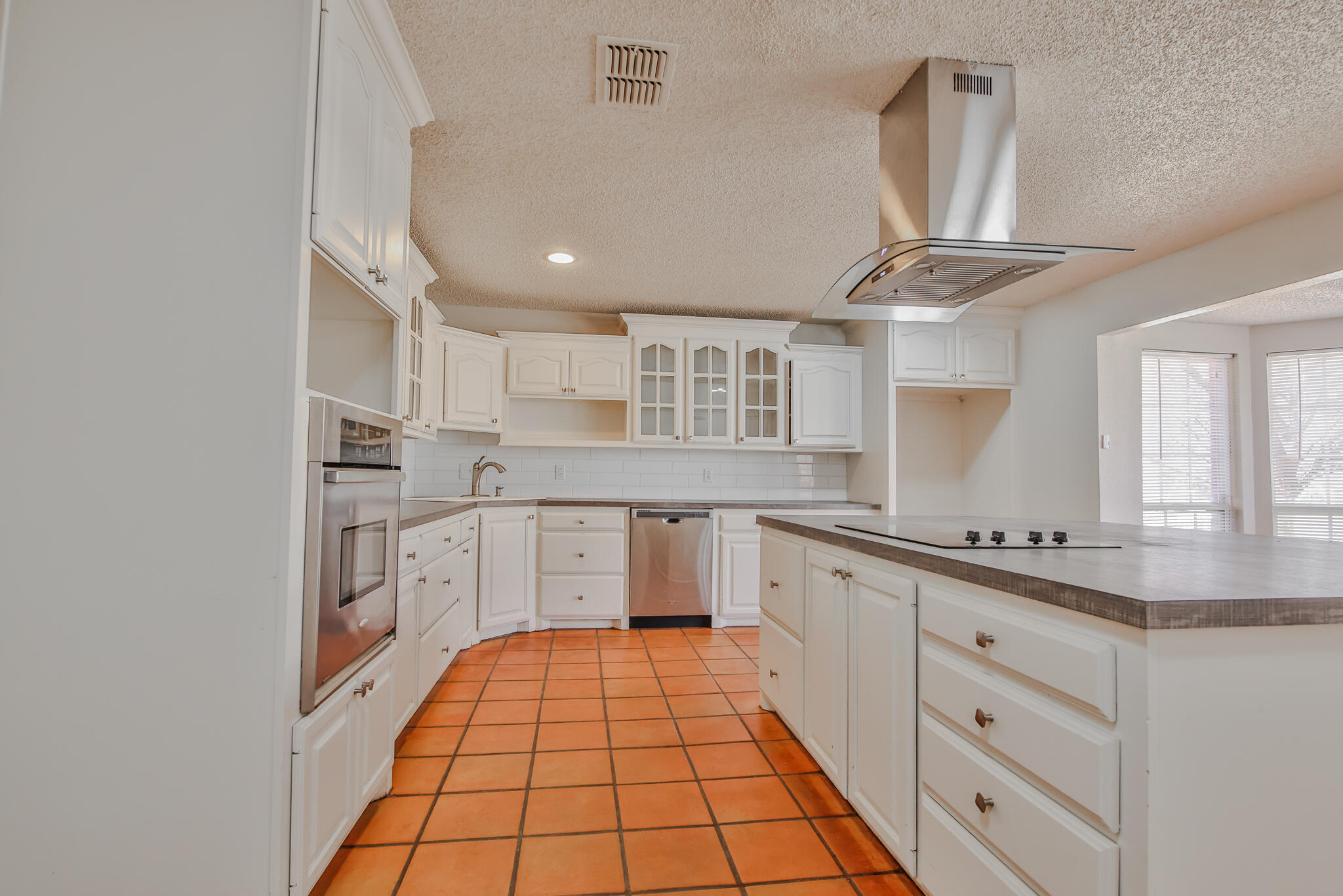 5437 45th Street Lubbock, TX 79414 - Photo 7 of 52 a kitchen with stainless steel appliances granite countertop a sink and cabinets