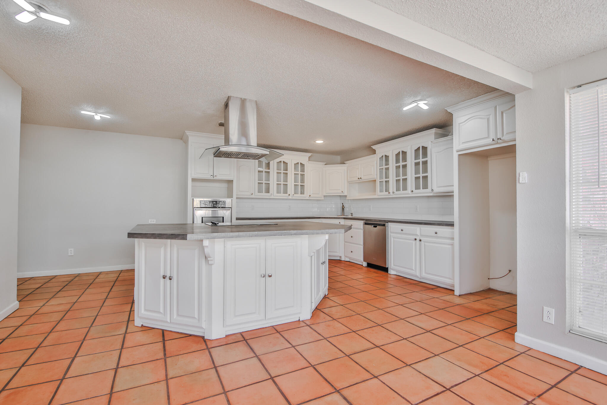 5437 45th Street Lubbock, TX 79414 - Photo 9 of 52 a kitchen with stainless steel appliances a sink and cabinets