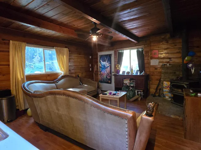 a living room with furniture fireplace and flat screen tv