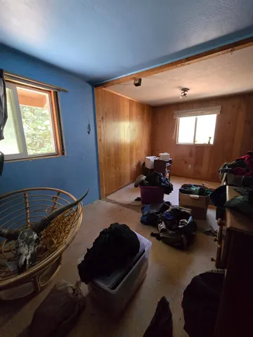 a bed room with furniture and a window