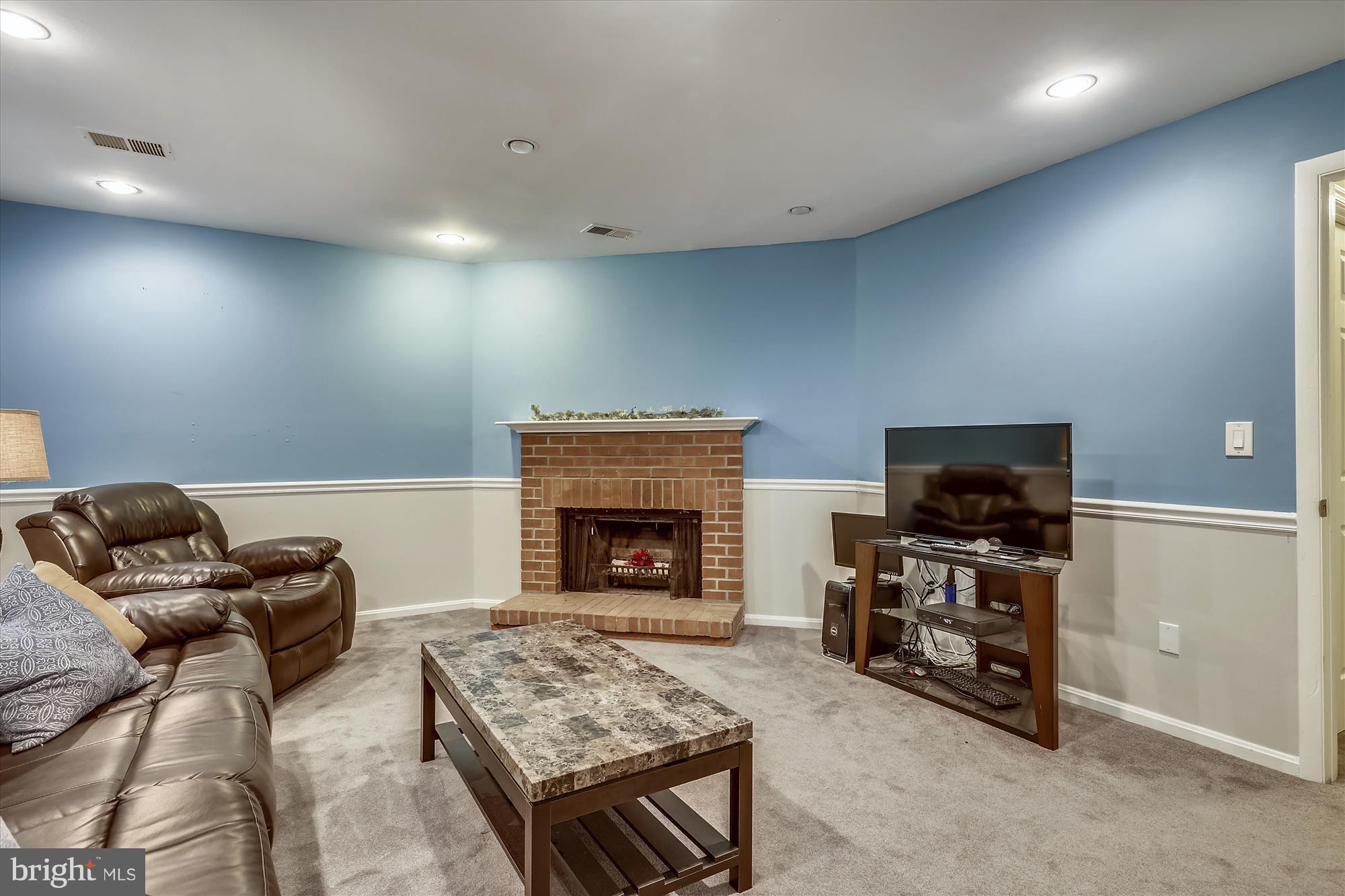 11735 Dry River Court Reston, VA 20191 - Photo 23 of 34 WOOD BURNING FIREPLACE FRAMES LOWER LEVEL REC ROOM