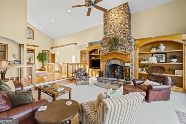a kitchen with stainless steel appliances granite countertop a sink stove and wooden floor