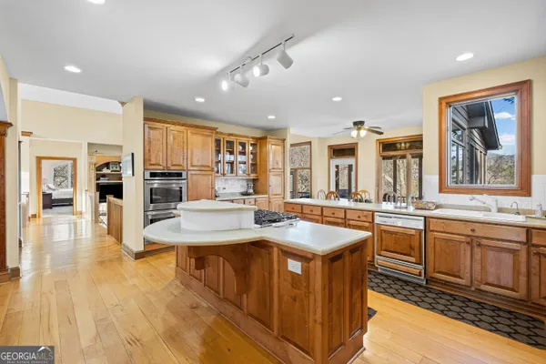 a kitchen with a sink stove and cabinets