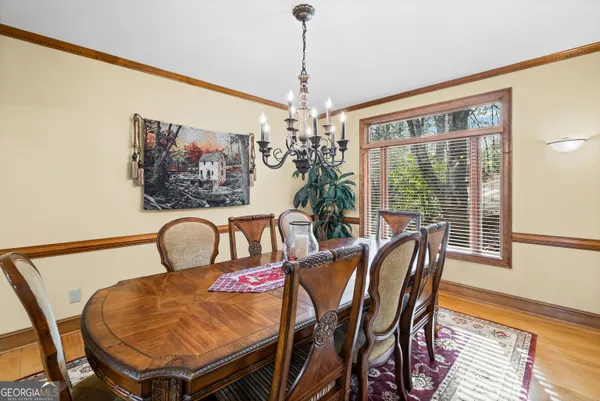 a view of a dining room with furniture window and wooden floor
