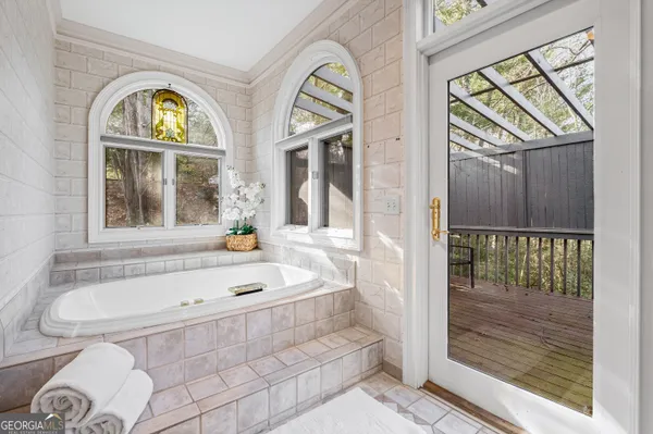 a spacious bathroom with a granite countertop sink mirror and toilet