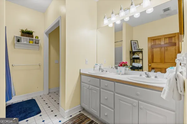 a balcony with furniture and a potted plant