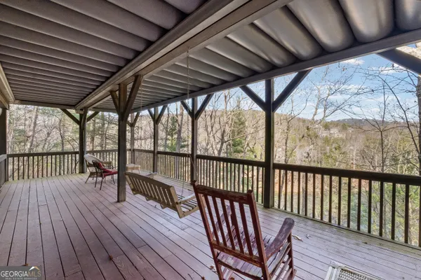 a view of a patio with wooden floor