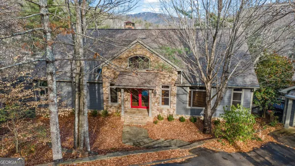 a view of a house with a tree